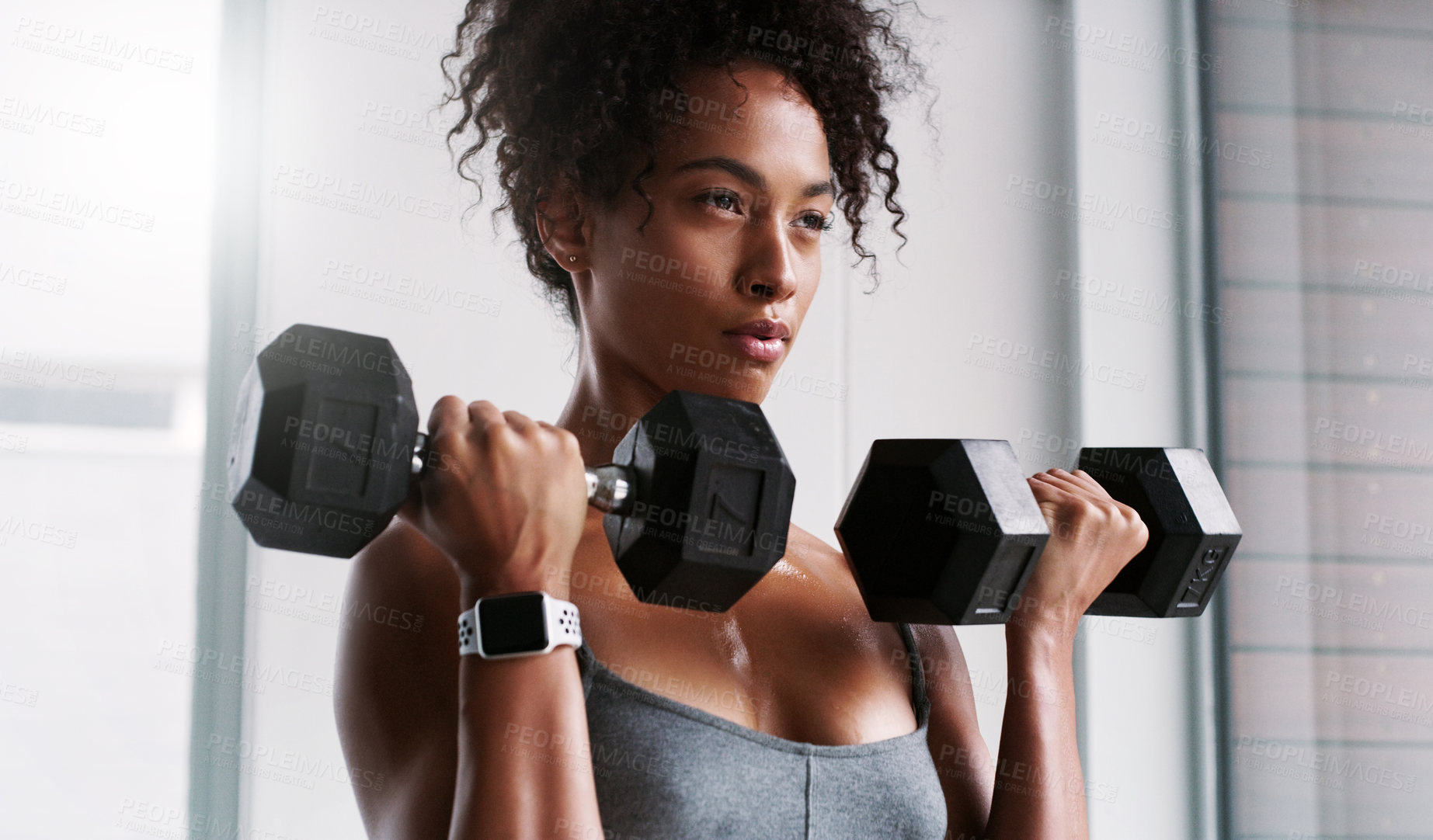 Buy stock photo African woman, dumbbells and exercise for fitness with thinking, wellness and muscle development in gym. Person, bodybuilder and weightlifting for change, training and challenge for transformation