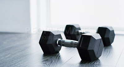 Buy stock photo Shot of two dummbells in a modern gym