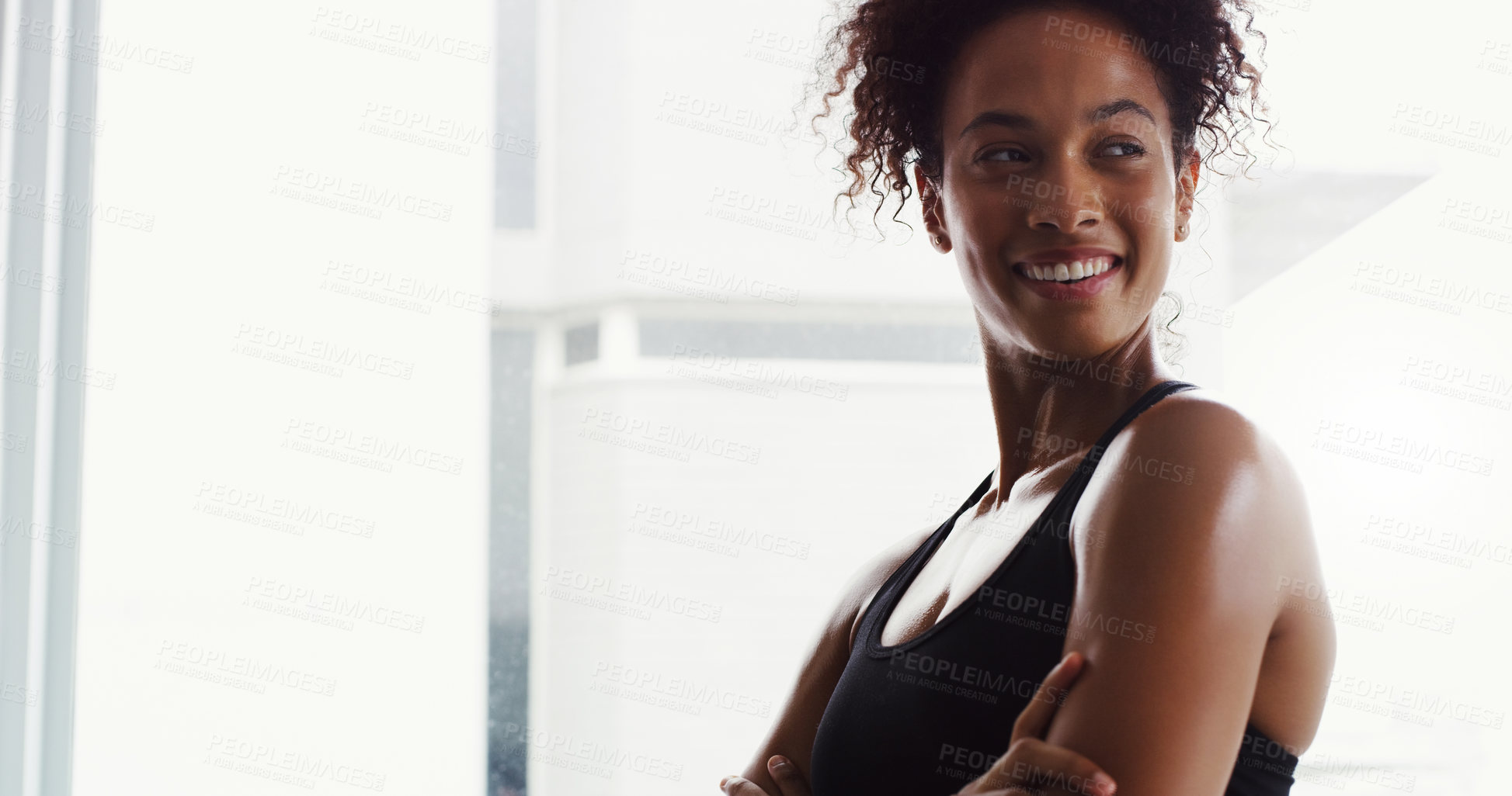 Buy stock photo Shot of a confident young woman working out in a gym