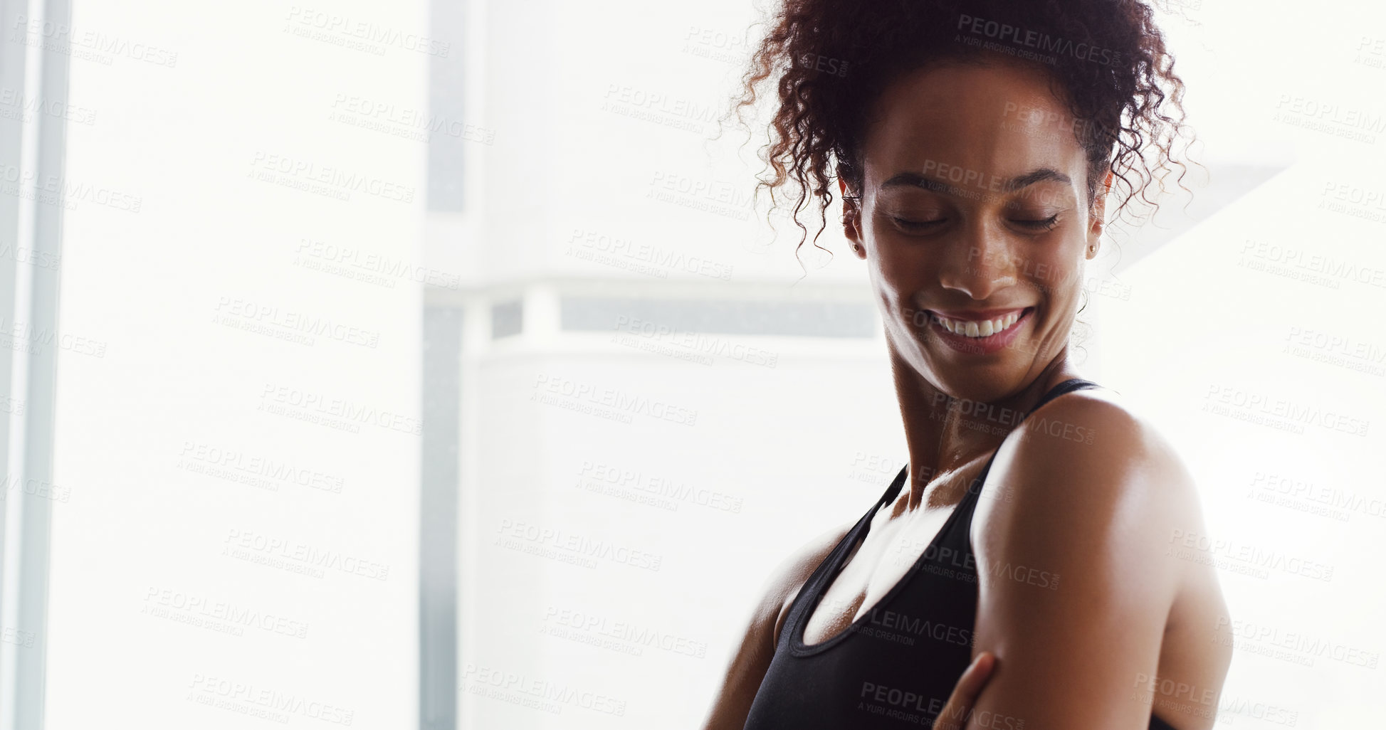 Buy stock photo Shot of a confident young woman working out in a gym