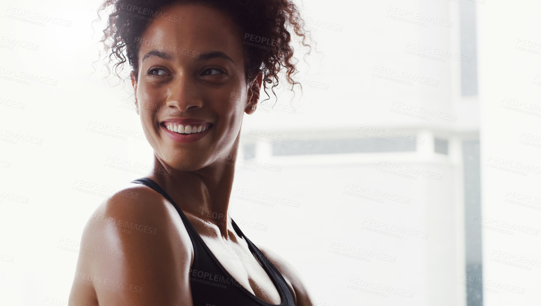 Buy stock photo Shot of a confident young woman working out in a gym