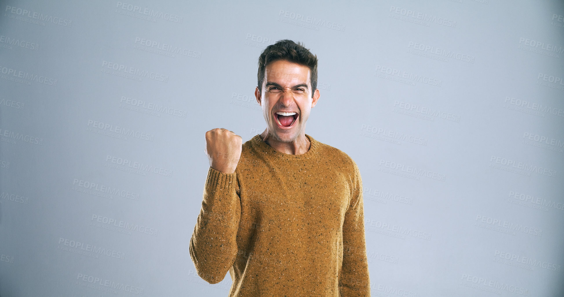 Buy stock photo Man, fist and smile for celebration in studio with shout, success and portrait for bonus by background. Person, excited and winning for profit, prize and giveaway with lottery, contest or competition