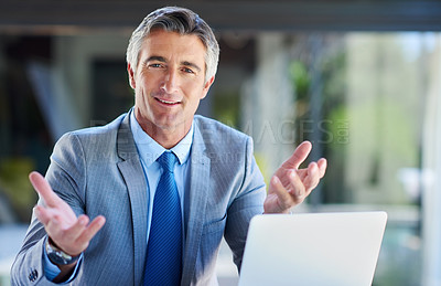 Buy stock photo Cropped portrait of a handsome mature businessman working on a laptop outdoors