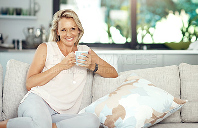 Buy stock photo Mature, woman and portrait with coffee in home for relax, wellness and weekend break with comfortable on sofa. Person, happy and drinking tea on couch in lounge with pride, confidence and beverage