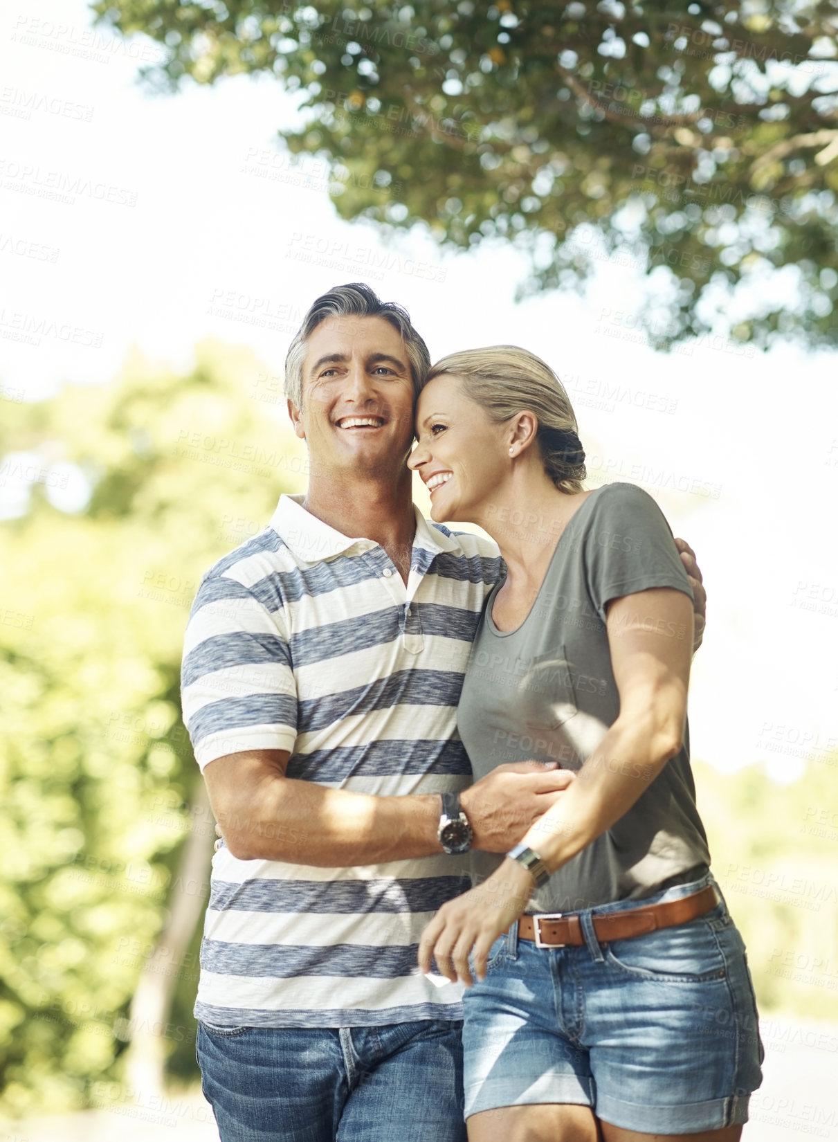 Buy stock photo Happy, love and couple in park walking for bonding, relationship and relax in morning outdoors. Nature, marriage and mature man and woman laughing for romance, affection and care on weekend together