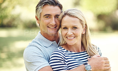 Buy stock photo Cropped portrait of an affectionate mature couple enjoying a day in the park