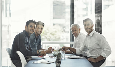 Buy stock photo Cropped portrait of a group of businessmen having a meeting around a table in an office