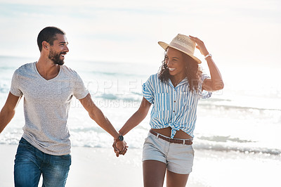 Buy stock photo Love, smile and holding hands with couple, beach and happy relationship for anniversary on holiday together. Romance, African man and woman with ocean, break and bonding with sunset on vacation