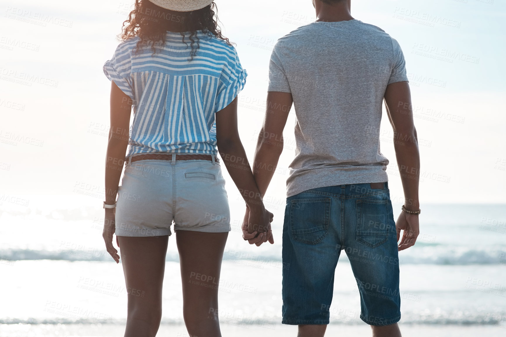 Buy stock photo Couple, back and holding hands at beach for holiday, summer and tropical vacation together in San Diego. Man, woman and date on sand by ocean for adventure, love and relax on travel with partner