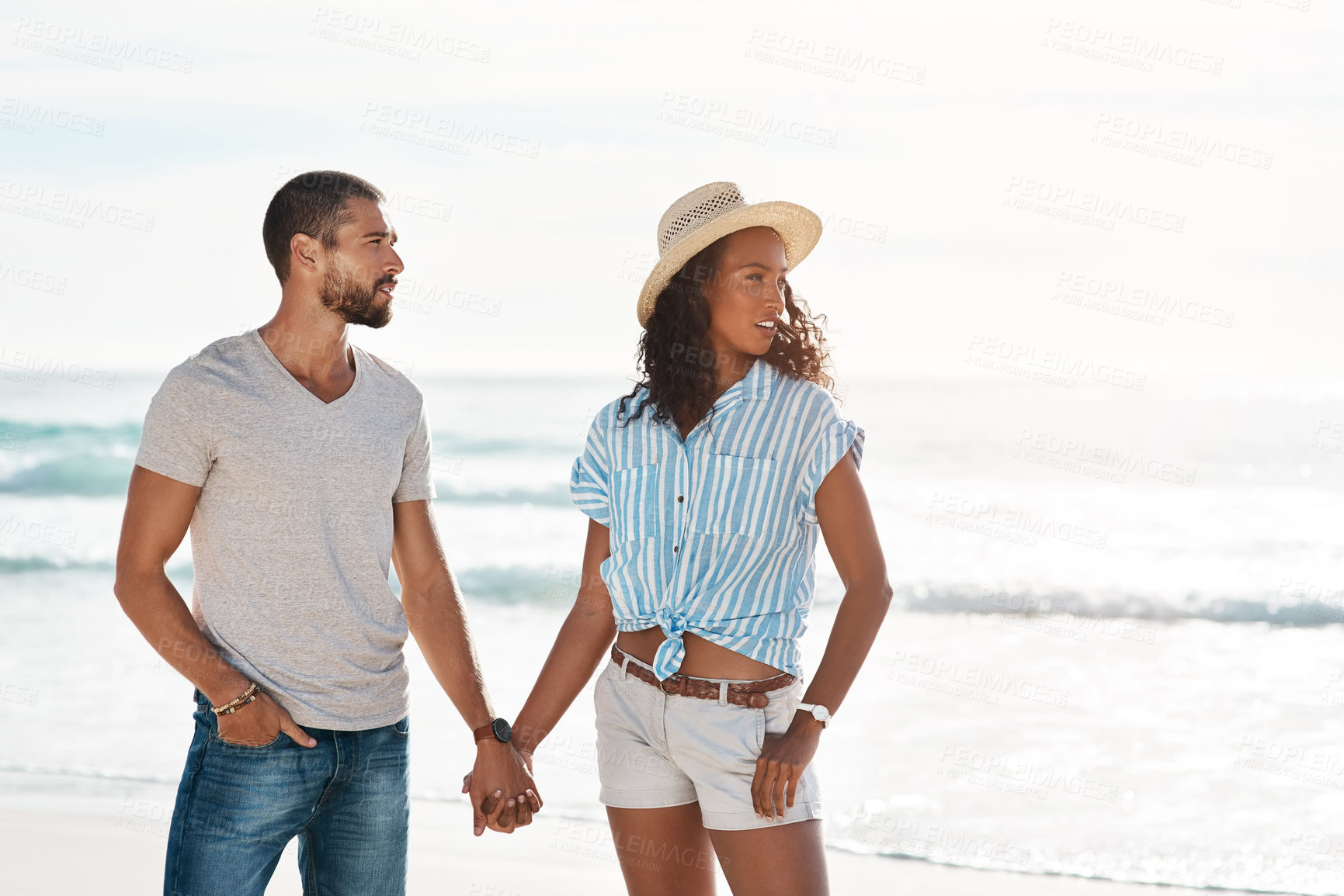 Buy stock photo Love, adventure and holding hands with couple, beach and happy relationship for anniversary on holiday together. Romance, African man and woman with ocean, break and bonding with sunset on vacation