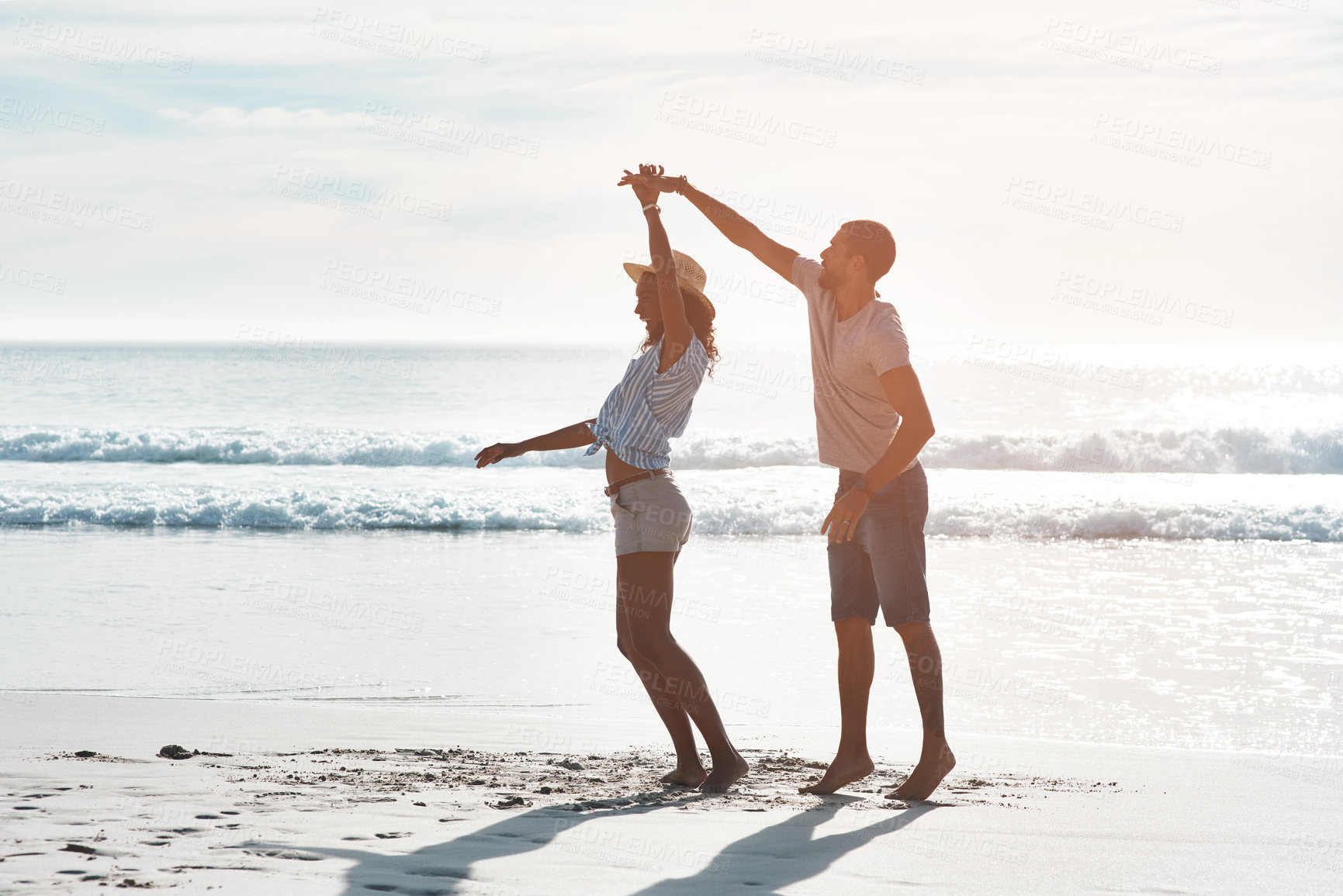 Buy stock photo Happy, couple and dance with support at beach for outdoor adventure, marriage and honeymoon holiday. Man, woman and celebration with waves by ocean for commitment, connection and vacation in Cancun