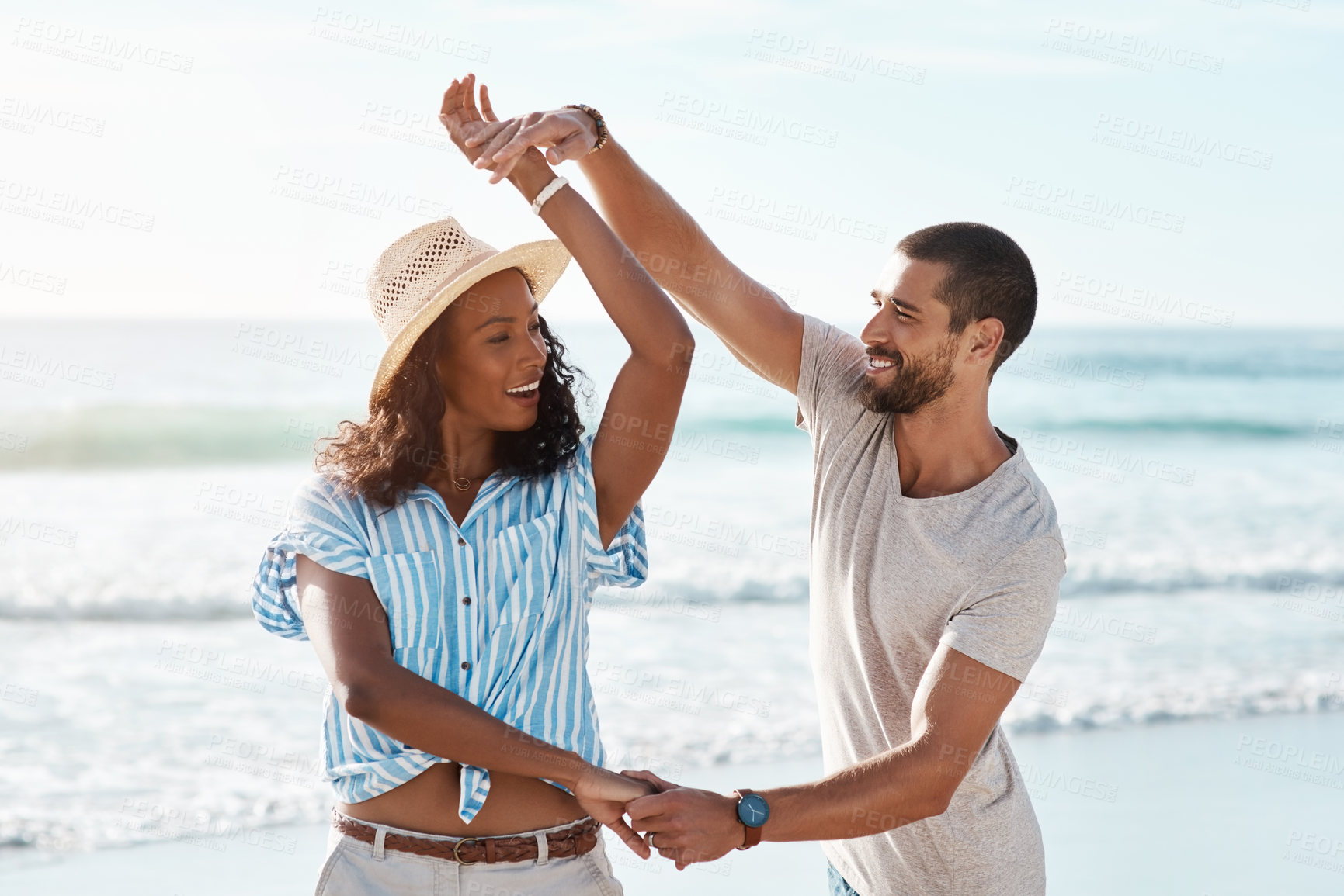 Buy stock photo Couple, smile and dance with love at beach for outdoor adventure, marriage and honeymoon vacation. Woman, man and celebration with waves by ocean for connection, commitment and holiday in Cancun