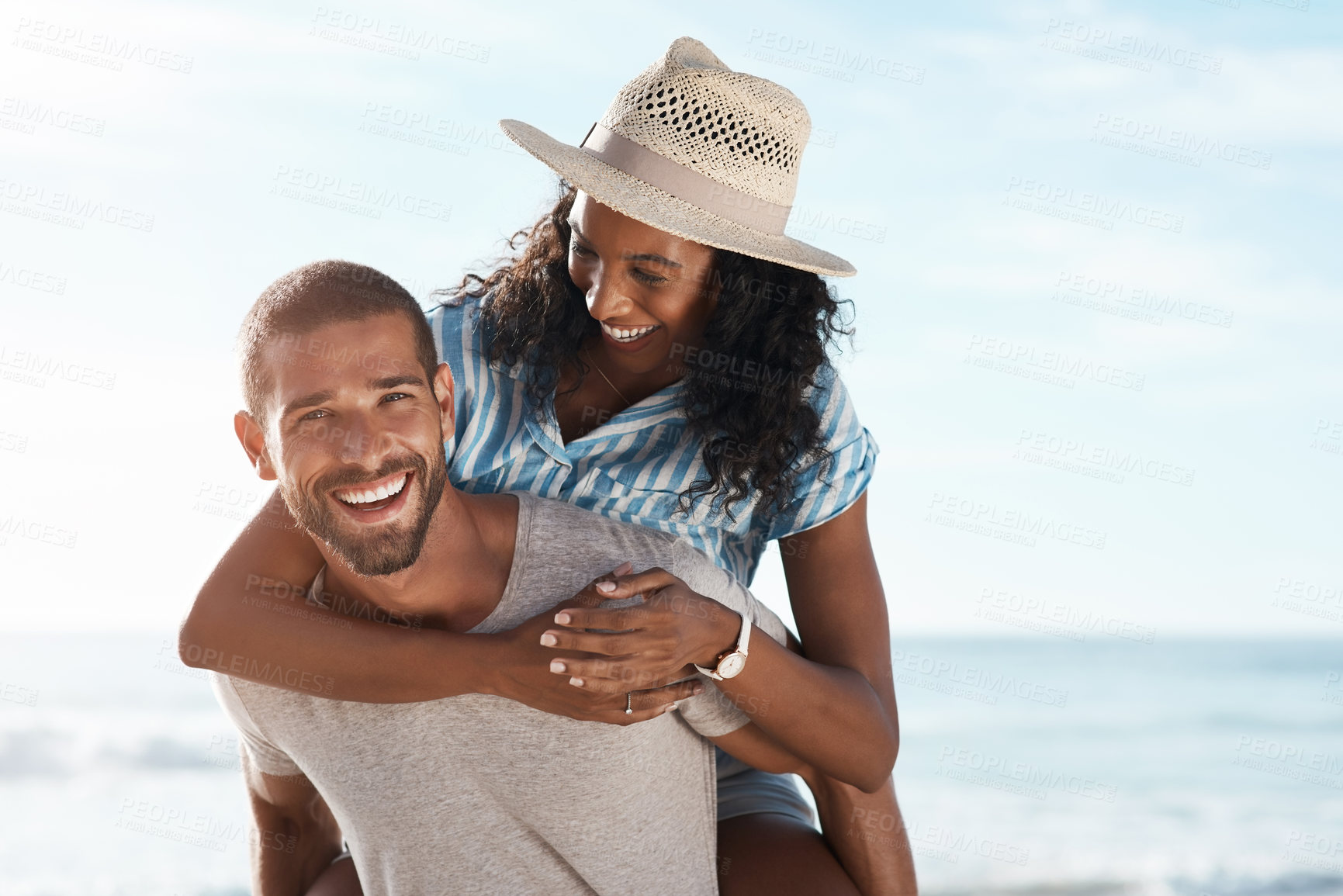 Buy stock photo Love, portrait and piggyback with couple, beach and happy relationship for anniversary on holiday together. Romance, African man and woman with ocean, summer break and bonding with sunset on vacation