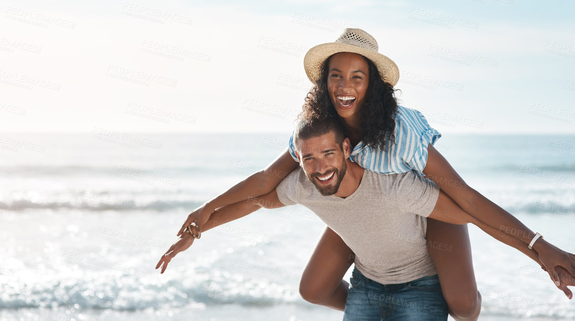 Buy stock photo Couple, happy and piggyback at beach for travel, summer and tropical holiday together in San Diego. Man, woman and carrying on sand by ocean for adventure, love and relax on vacation with portrait