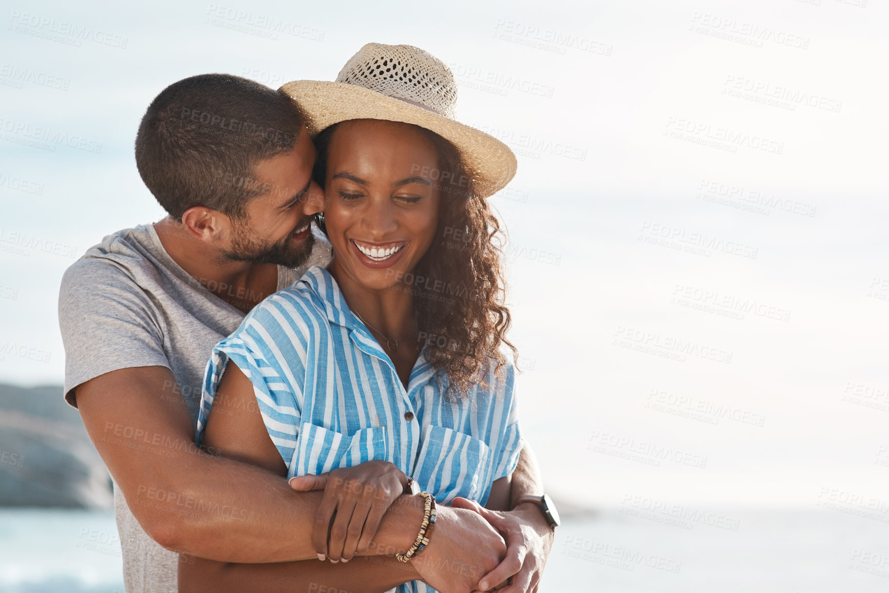 Buy stock photo Love, affection and hug with couple, beach and happy people for anniversary on holiday together. Romance, African man and woman with ocean, summer break and relax with sunset adventure on vacation