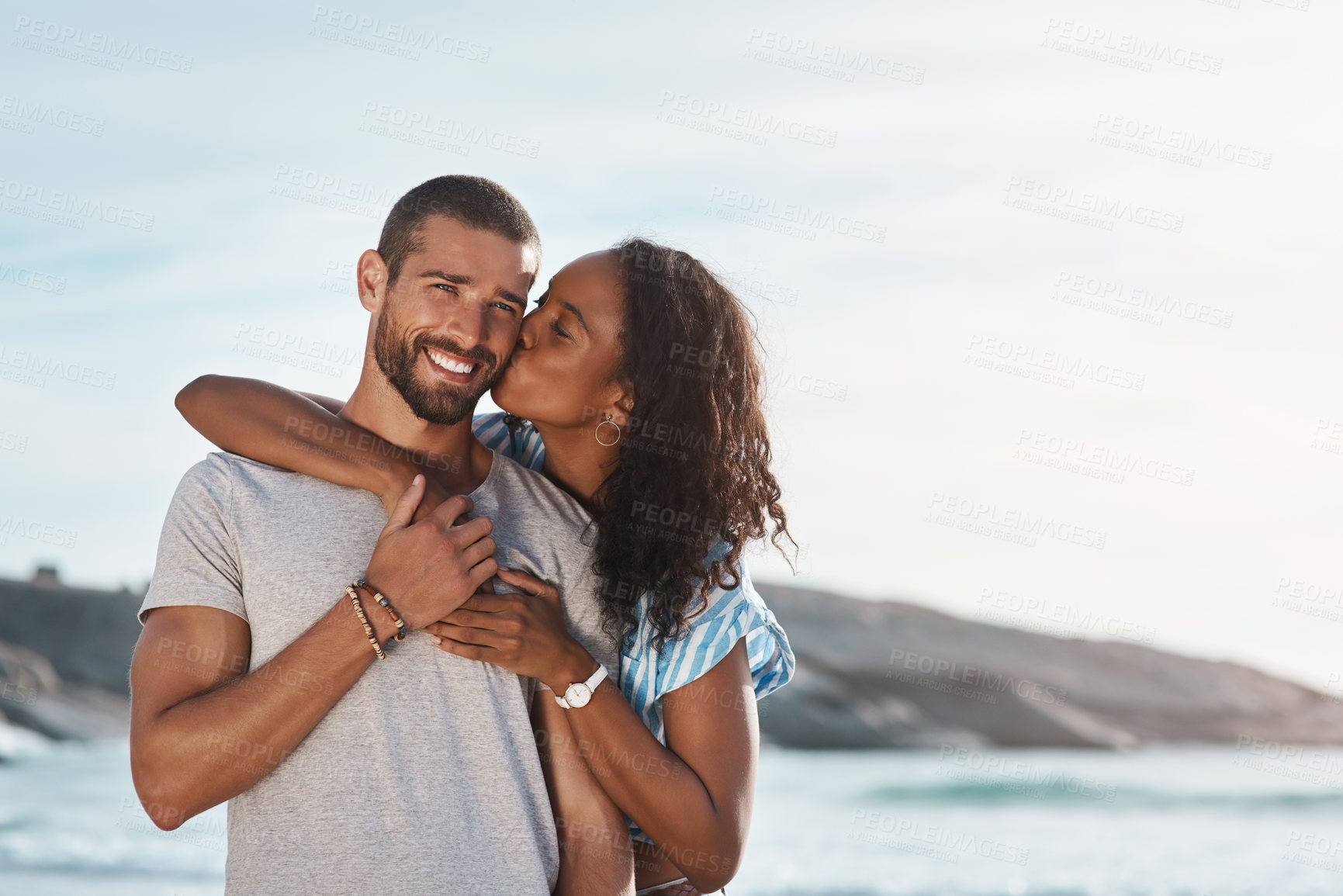 Buy stock photo Travel, portrait and kiss with couple, beach and happy people for anniversary on holiday together. Romance, man and woman with ocean for summer break and relax with sunset embrace on vacation