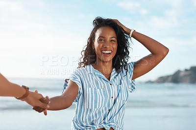 Buy stock photo POV shot of a young woman holding her boyfriend's hand at the beach