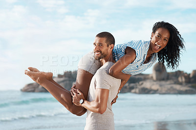 Buy stock photo Couple, portrait and lifting at beach for travel, summer and tropical holiday together in San Diego. Man, woman and playful on sand by ocean for adventure, love and relax on vacation with partner