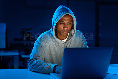 Buy stock photo Black man, hoodie or hacker with laptop for cybercrime, malware or phishing for stealing online. Programmer, night or typing software update on technology with hacking expert writing algorithm system