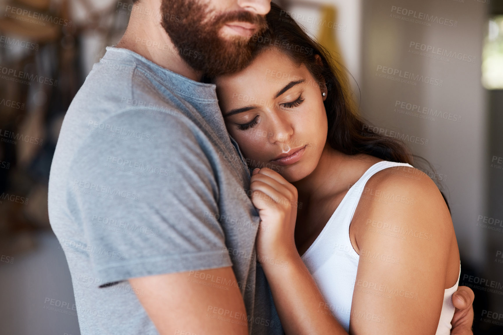 Buy stock photo Love, woman and home couple hug for relationship security, safety support and empathy in living room. Intimacy, marriage bond and romantic people embrace with affection, care or relax in quality time