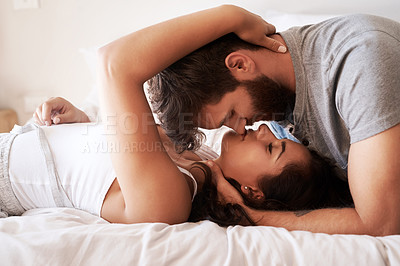 Buy stock photo Couple, bedroom and embrace with face, smile and together in morning for romance, love and bonding in home. Young man, woman and happiness to relax in bed with care, support and kiss at apartment