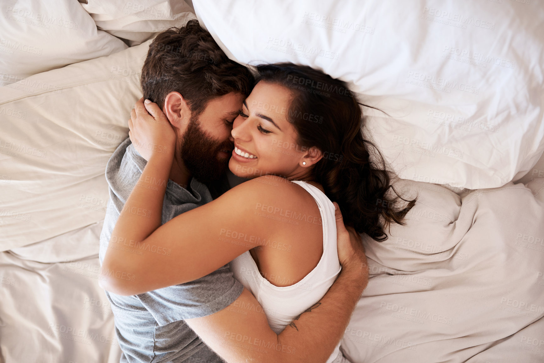 Buy stock photo Home bedroom, affection and happy couple hug, relax and enjoy relax morning together, bonding and smile. Happiness, intimate and top view of romantic woman, man or people embrace on hotel bed fabric