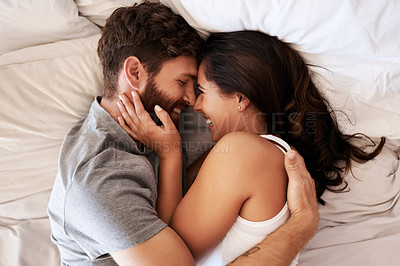 Buy stock photo Smile, bed and happy couple hug, relax and spending lazy morning together, bonding and intimacy on Spain vacation. Happiness, marriage and top view of romantic man, woman or people embrace in bedroom