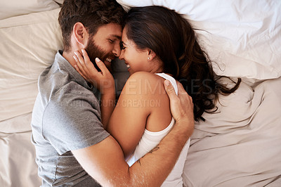 Buy stock photo Smile, bedroom hug and happy couple laughing at funny joke, relationship humour or home comedy in Spain. Marriage happiness, love bond and top view of relax man, woman or morning people laugh in bed