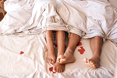 Buy stock photo Bed, legs and couple with Valentines Day heart, romance or emoji icon for home love, intimacy and honeymoon affection. Marriage bond, relax sleep and top view feet of people sleeping in hotel bedroom