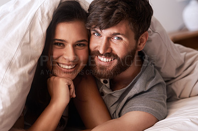 Buy stock photo Bed blanket, face and portrait of happy couple, relax and enjoy morning together bonding on Croatia vacation holiday. Happiness, smile and romantic woman, man or people resting in home bedroom