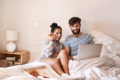 Buy stock photo Couple, pizza and movie on laptop in bed with junk food and streaming series. Eating, computer video and meal in a bedroom at home with man and woman together with bonding and online watching