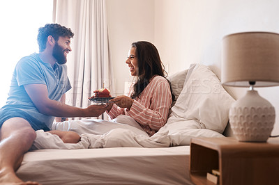 Buy stock photo Happy couple, bedroom and surprise birthday muffin, morning dessert or celebration food for excited woman. Cupcake candle, candy and fun people smile, happiness and celebrate special day on home bed