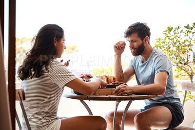 Buy stock photo Home food, breakfast and couple eating meal, morning brunch or lunch on Valentines Day date on balcony. Love, marriage and romantic man, woman or people bonding, care and enjoy quality time together