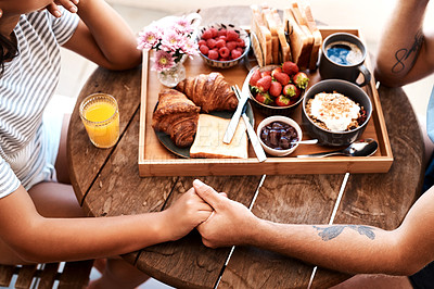 Buy stock photo Cafe food, breakfast and couple holding hands for support care, bonding or love on Valentines Day date. Morning, romantic people and brunch tray of croissant, strawberry or bread in coffee shop store