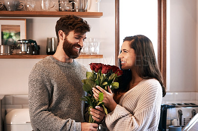 Buy stock photo Flowers, surprise gift and happy couple with roses, floral present or flower bouquet for Valentines Day in home kitchen. Wow, bonding and romantic man with love present, care and enjoy quality time