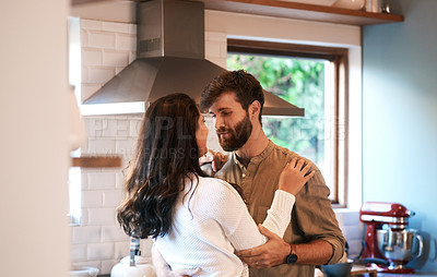 Buy stock photo Young couple, dance and kitchen in home with love, passion and cooking together for romance, care or bond. Man, woman and hug with dancing, moving and connection for food, nutrition or diet in house