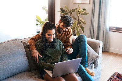 Buy stock photo Laptop, credit card and happy couple on sofa, online shopping or cashback and spending in home. Smile, man and woman on couch to relax together, ecommerce or payment with bonding time and happiness.