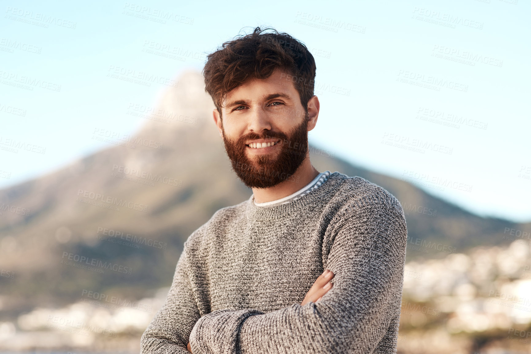 Buy stock photo Nature portrait, arms crossed and happy man relax with outdoor wellness, vacation freedom and smile for peace. Summer sunshine, mountain and male person on travel holiday in Cape Town, South Africa
