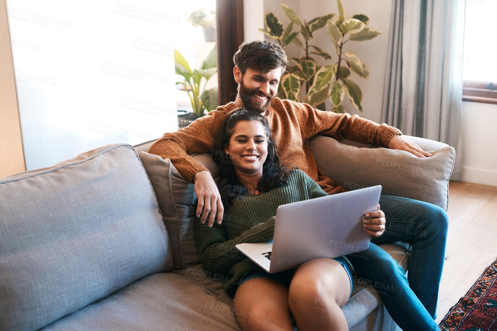 Buy stock photo Relax, love and laptop with couple on sofa for happy, social media and streaming. Smile, internet and subscription with man and woman online in living room at home for network, news and website