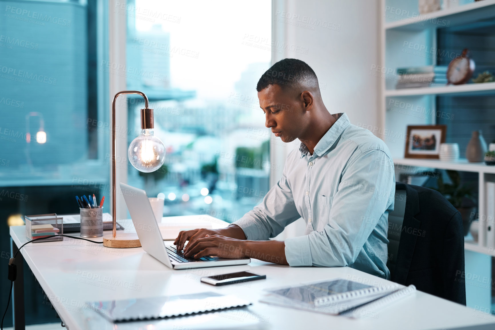 Buy stock photo Business, black man and research on laptop at office on desk with file or folder for task in Atlanta. Male person, light bulb and project manager with updating data or information for company finance