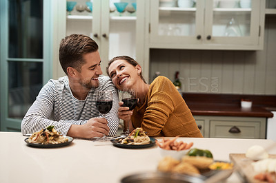 Buy stock photo Happy, couple and food in home with wine on date night for romance in relationship with bonding. Man, woman and together with dinner or alcohol in kitchen with love, trust and soul connection.