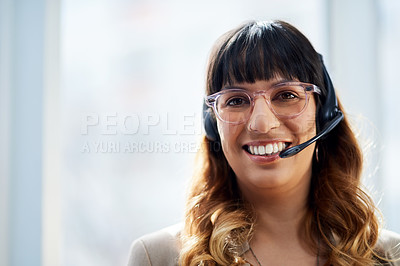 Buy stock photo Cropped portrait of an attractive young businesswoman posing with her headset on while in her office during the day