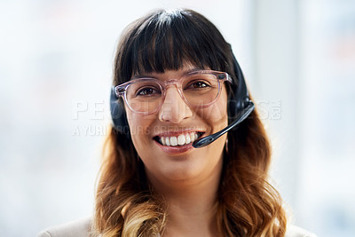 Buy stock photo Cropped portrait of an attractive young businesswoman posing with her headset on while in her office during the day