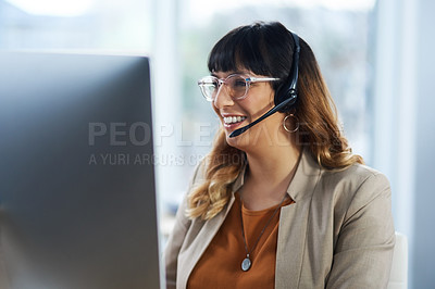 Buy stock photo Cropped shot of an attractive young businesswoman sitting and using a headset in her office during the day