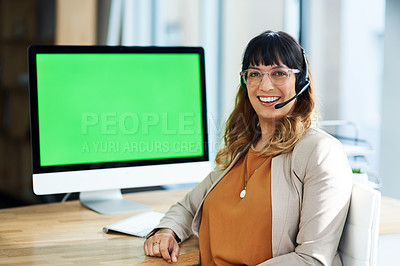 Buy stock photo Cropped portrait of an attractive young businesswoman sitting and using a headset in her office during the day