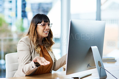 Buy stock photo Cropped shot of an attractive young businesswoman sitting at her desk and confused while in her office
