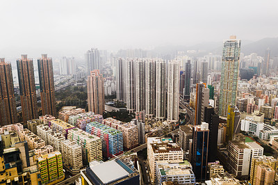 Buy stock photo Shot of skyscrapers, office blocks and other commercial buildings in the urban metropolis of Hong Kong