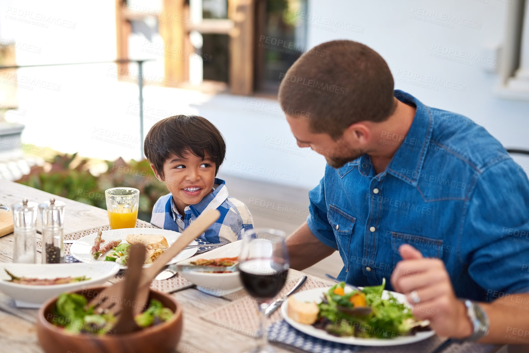 Buy stock photo Dad, boy and happy with food in home at table on patio for lunch, bonding and thanksgiving. Parent, kid and smile for festive season or gathering for tradition, support and love with care and trust