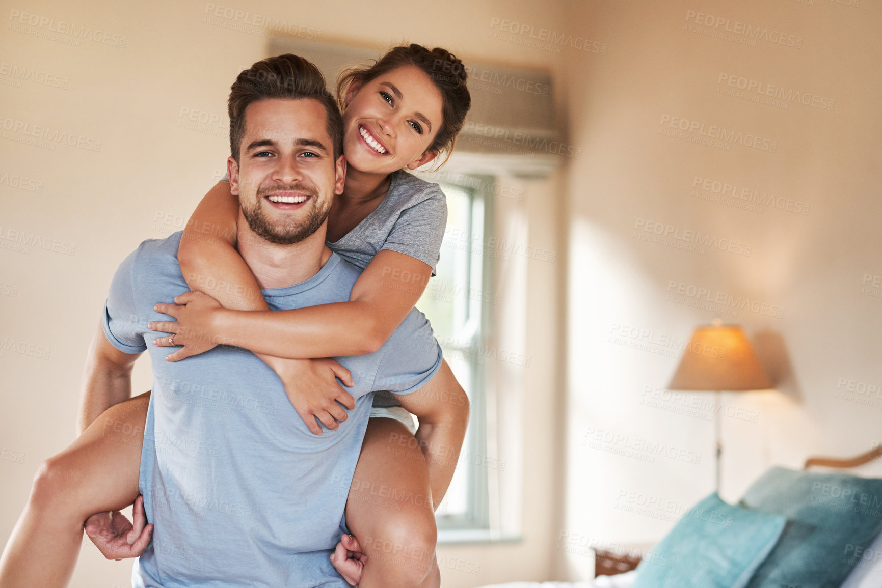 Buy stock photo Portrait of a playful young couple spending some quality time together in their bedroom