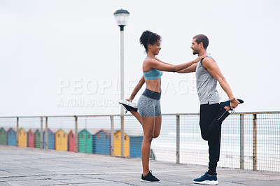 Buy stock photo Man, woman and stretching together for wellness, exercise or fitness and flexibility training. Female athlete, personal trainer and warm up on promenade for health, support and cardio in Los Angeles